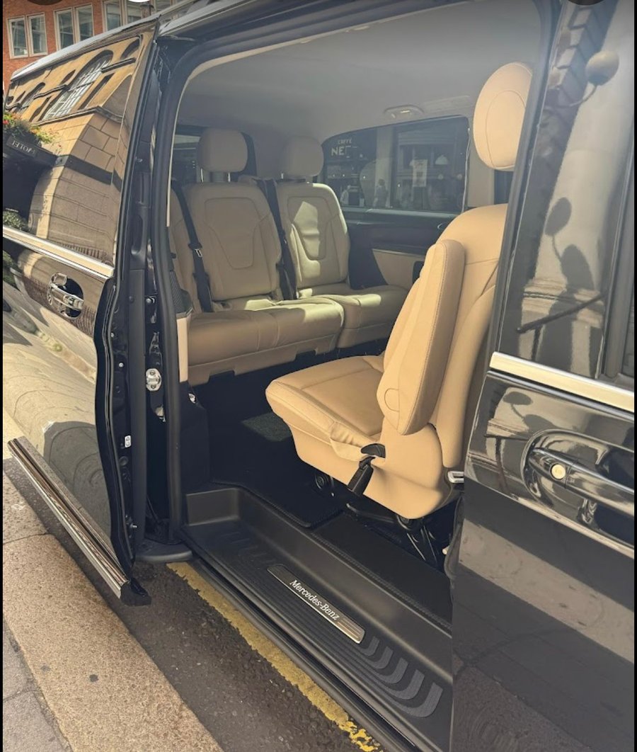 Spacious cream-leather cabin of our chauffeur-driven Mercedes V-Class